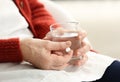 Elderly woman taking pill, closeup