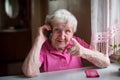 Elderly woman talking on mobile phone Royalty Free Stock Photo