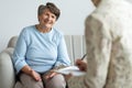 Elderly woman talking to a financial advisor about a loan