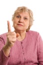 The elderly woman threatens with a finger