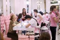 An elderly woman uses a manicure in the salon. Shopping center