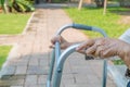 Elderly woman using walker in backyard Royalty Free Stock Photo