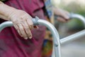 Elderly woman using a walker in backyard Royalty Free Stock Photo