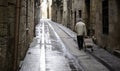 Elderly woman walking street