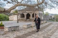 An elderly woman walking the streets of Vitsa in Zagori area in Northern Greece