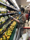 Elderly woman wearing protective mask shopping groceries during covid-19 pandemic