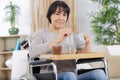 elderly woman on wheelchair having breakfast Royalty Free Stock Photo