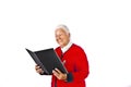 Elderly woman with white hair reading in a book and making a Royalty Free Stock Photo