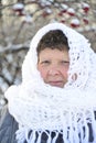 Elderly woman in white knitted shawl costs about Royalty Free Stock Photo