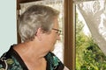 Elderly woman at window