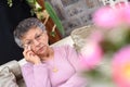 Elderly woman wiping tears Royalty Free Stock Photo