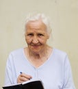 Elderly woman with worksheet