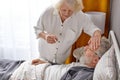 elderly woman is worried about health condition of sick husband Royalty Free Stock Photo