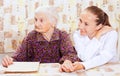 Elderly woman with the young smileing doctor