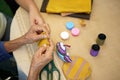 Elderly woman with caregiver in the needle crafts occupational therapy  for Alzheimer or dementia Royalty Free Stock Photo