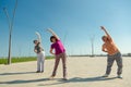 Elderly women doing sports training with a trainer in a public park, recreation fitness after sickness. Royalty Free Stock Photo