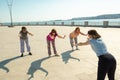 Elderly women doing sports training with a trainer in a public park, recreation fitness after sickness. Royalty Free Stock Photo