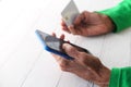 elderly women hand holding credit card and using smart phone shopping online Royalty Free Stock Photo