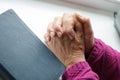 Elderly women hands crossed in prayer