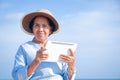 Elderly women holding tablet communication devices Royalty Free Stock Photo