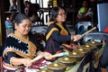 Elderly women playing gong