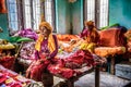 Elderly women sit on their beds in a retirement home, Nepal