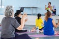 Elderly in a yoga exercise posture