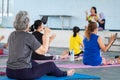 Elderly in a yoga exercise posture