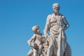 Elderly and young Ã¢â¬â old sculpture of engineer and his scholar on Zoll Bridge in Magdeburg downtown at blue sky background,