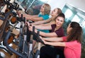 Elderly and young women working out hard in sport club Royalty Free Stock Photo