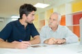 Eldery father granfather and son working together Royalty Free Stock Photo