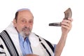 Eldery jewish man blowing the Shofar horn for Rosh Hashanah Royalty Free Stock Photo