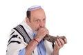 Eldery jewish man blowing the Shofar horn for Rosh Hashanah Royalty Free Stock Photo