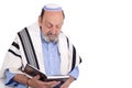 Eldery jewish man wrapped in talit praying