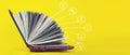 Elearning concept - laptop as book on yellow background. Knowledge base concept. Online Courses concept
