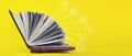 Elearning concept - laptop as book on yellow background. Knowledge base concept. Online Courses concept Royalty Free Stock Photo