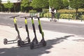 Electic scooters parked on the street, with copy space Royalty Free Stock Photo