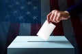Election in America Concept. Hand Dropping a Ballot Card into th Royalty Free Stock Photo
