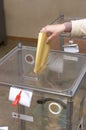 Election: ballot box and hand