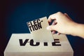 Election card insert in vote box, democracy concept Royalty Free Stock Photo