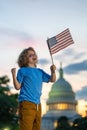 Election day. Child with American flag in Washington capitol, congress building. Voting concept. American Flag Day. Vote Royalty Free Stock Photo