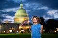 Election day for US Citizens. Child boy Vote with US flag near capitol building. Voting concept. American Flag Day. Vote Royalty Free Stock Photo