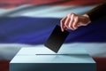 Election in Thailand Concept. Hand Dropping a Ballot Card into t Royalty Free Stock Photo