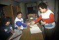 Election volunteers assisting voters in a polling place, CA Royalty Free Stock Photo