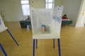 Election volunteers and voting booths in a polling place, CA