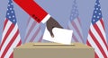 The hand of an African American throwing his vote into the ballot box. American flags in the background Royalty Free Stock Photo