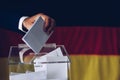 Elections in Germany. Man throwing his vote into the ballot box