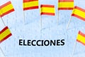 Elections in Spain, The concept of the Spanish flag and the text ELECCIONES meaning vote in English on white puzzles