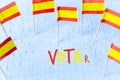 Elections in Spain, Spanish flag concept and VOTAR lettering meaning vote in English on white puzzle pieces