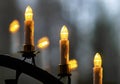 3 electric Advent candles conjure atmospheric light Royalty Free Stock Photo